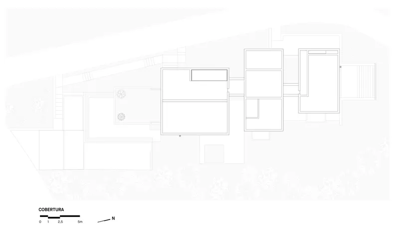 Roof plan drawing showing offset rectangular volumes with a pool and landscaped areas