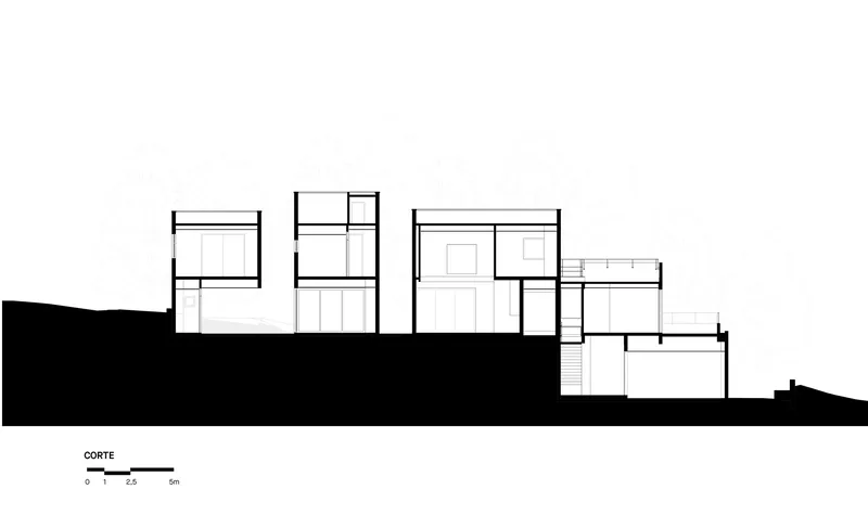 Section drawing revealing staggered interior levels carved into a sloped site