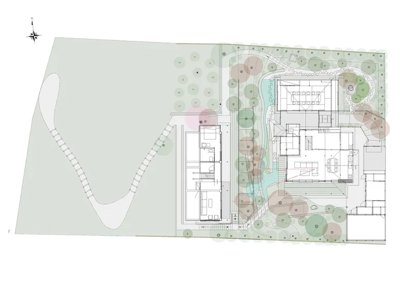 Site plan drawing showing building footprints with central water feature and surrounding planted landscape