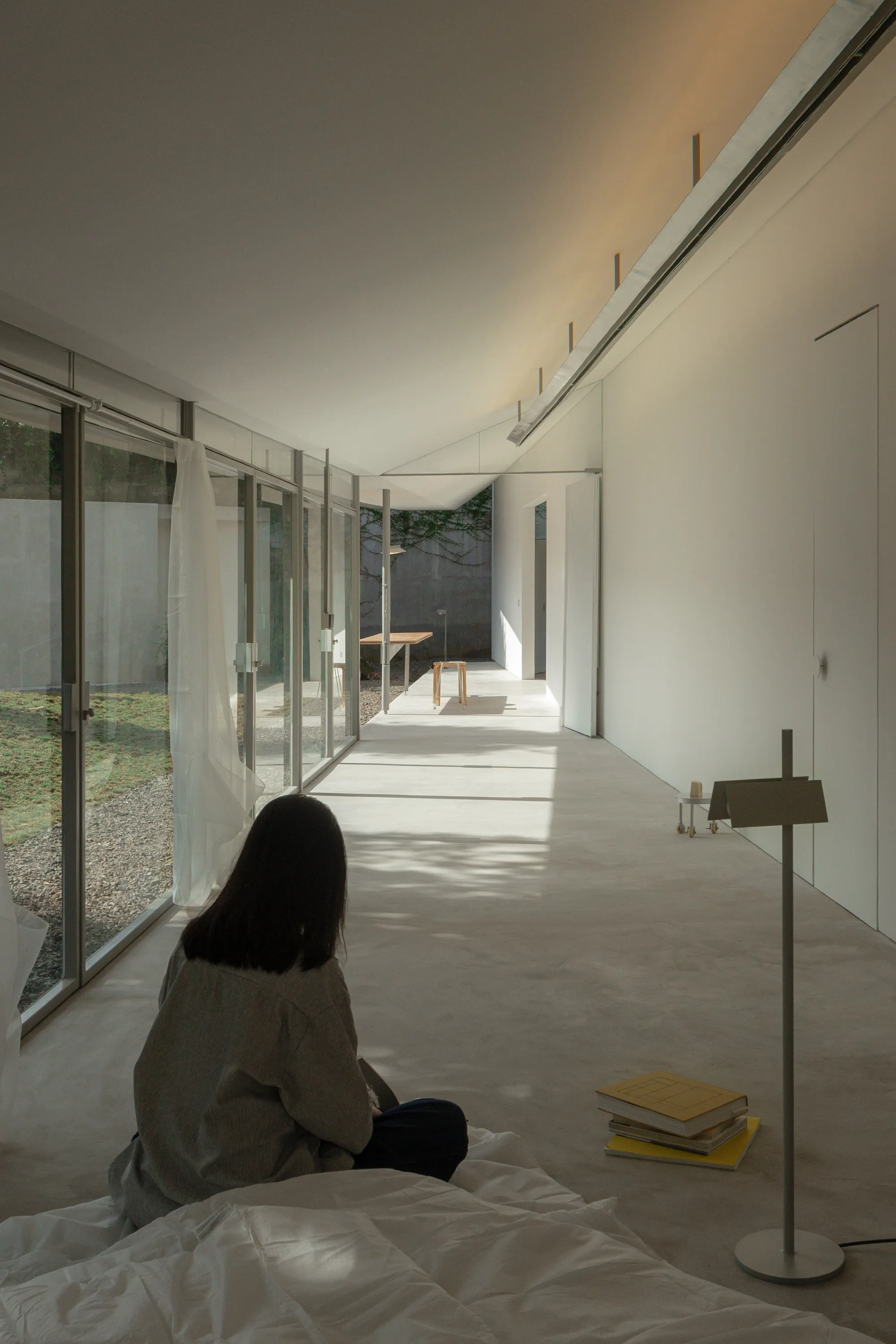 dua studio Stretches a 3.6-Meter-Wide House Across 24 Meters of Indonesian Garden
