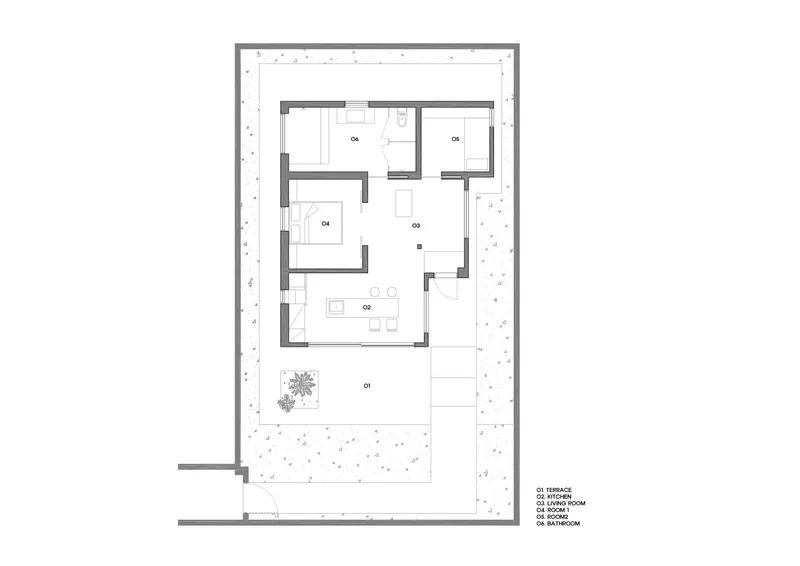 Floor plan drawing showing rectangular layout with courtyard and rooms labeled around central living space