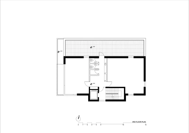 Third floor plan showing bedroom layout with central bathroom and deck access
