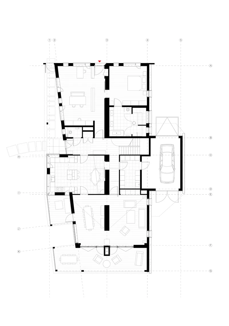 Floor plan drawing showing residential spaces with thick walls and a carport to the right