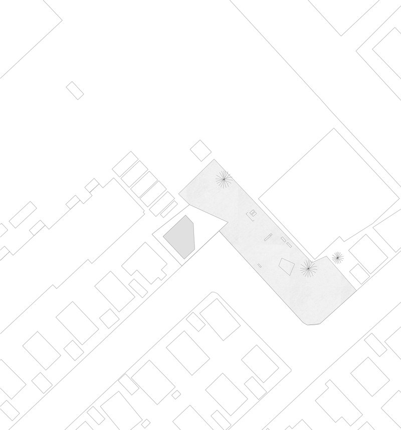 Site plan drawing showing a trapezoidal volume with courtyard positioned among neighboring rectangular structures