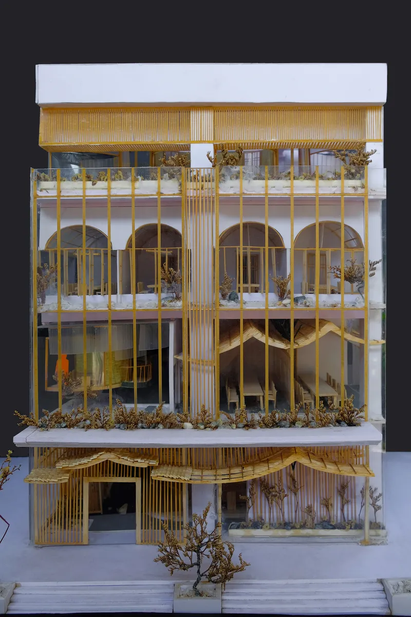 Front elevation of a physical sectional model showing timber lattice facade and arched floor openings