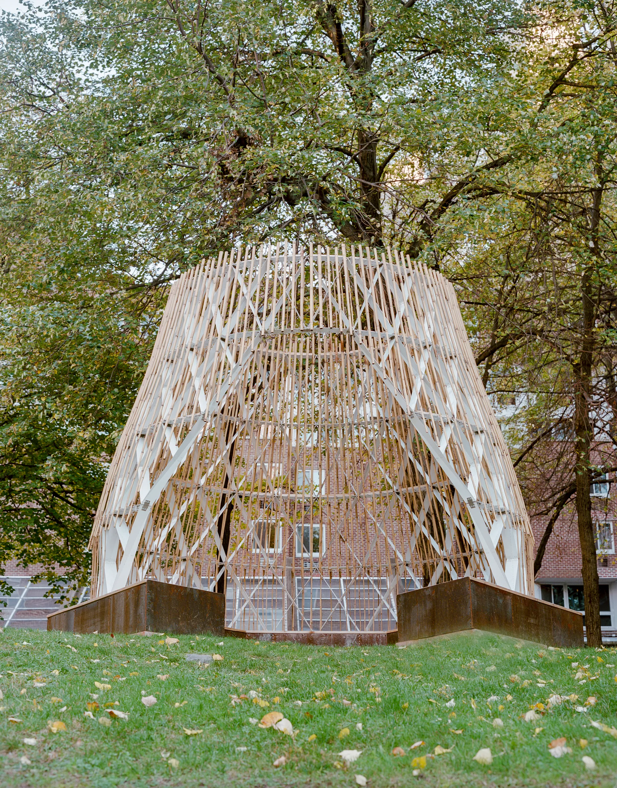 SAW.EARTH Plants a Brazilian Indigenous Hut in a Modernist Courtyard on Roosevelt Island