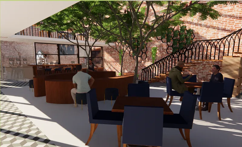 A lush central courtyard brings nature into the heart of the café, offering a tranquil setting for gathering, relaxation, and conversation.