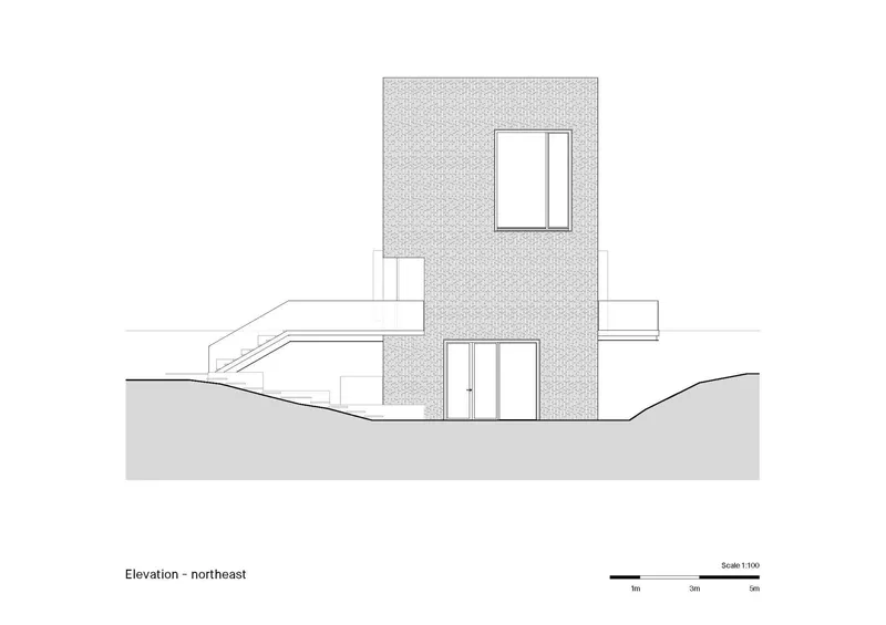 Northeast elevation drawing showing two-story tower volume with square windows and entry door