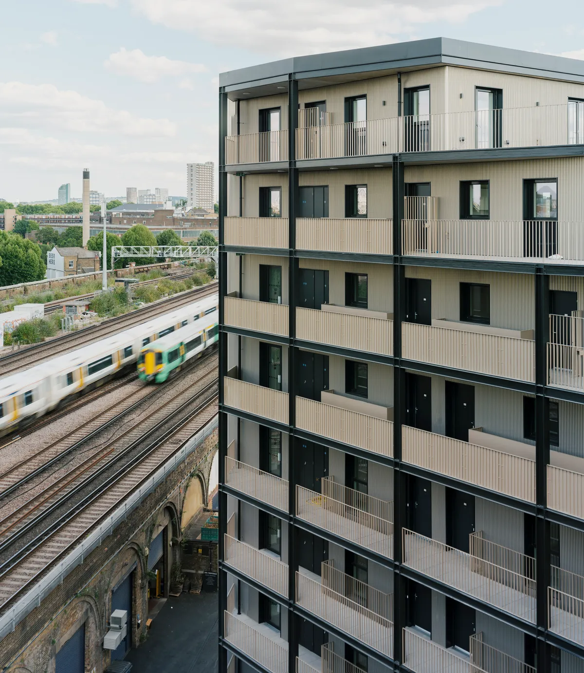 Studio Woodroffe Papa Wraps 111 Apartments Around a Courtyard with Saw-Tooth Balconies in Bermondsey