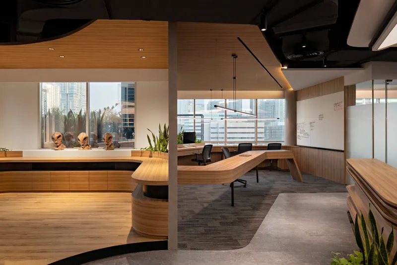 Open workspace with timber meeting table and city views through horizontal louvered window screens