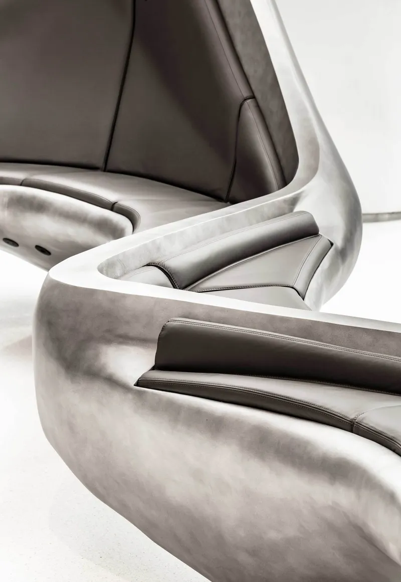 Close-up of leather-upholstered seating with curved metallic frame details