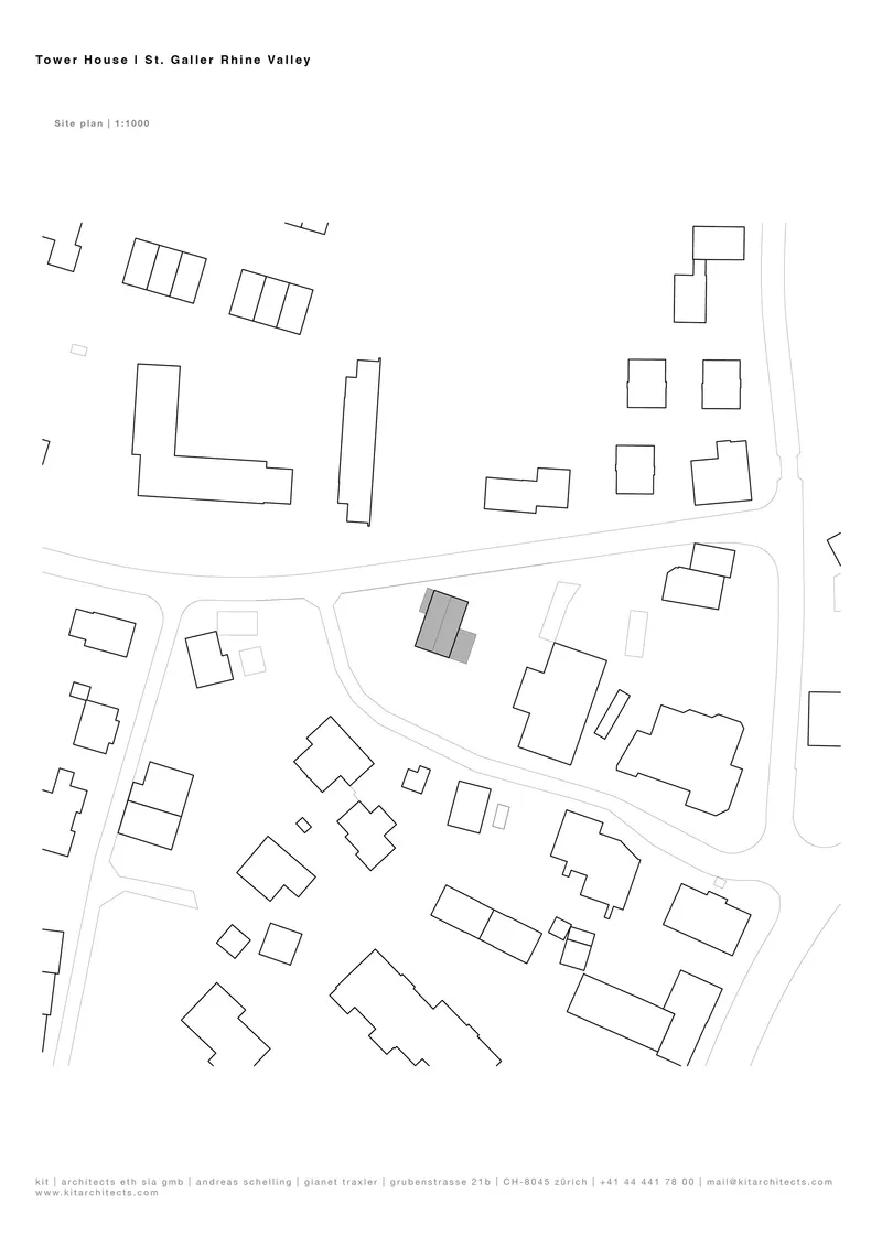 Site plan drawing depicting a single building footprint among scattered residential structures along a curved road