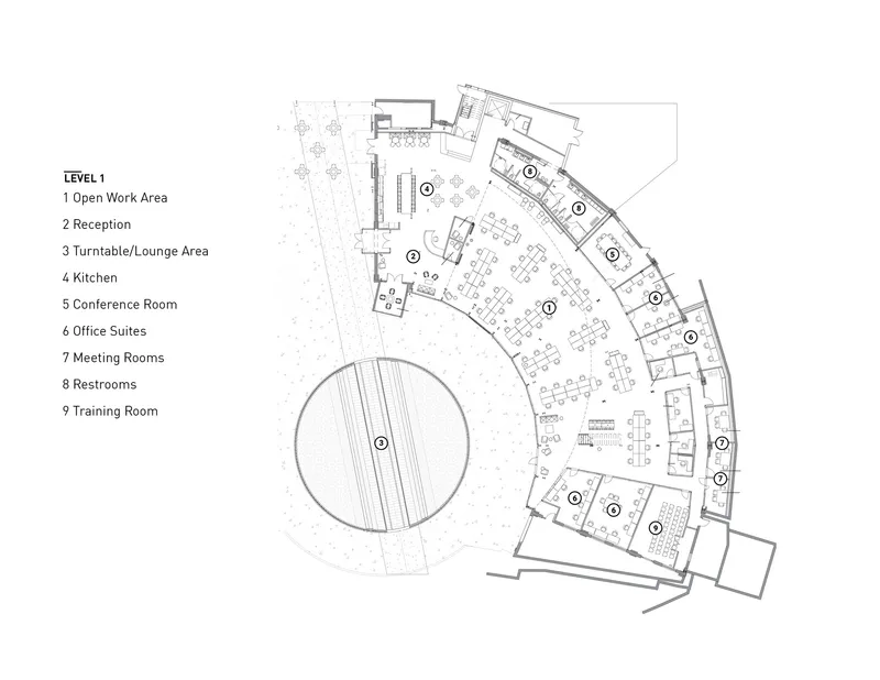First level floor plan showing the curved arc layout with central circular void and office suites along perimeter
