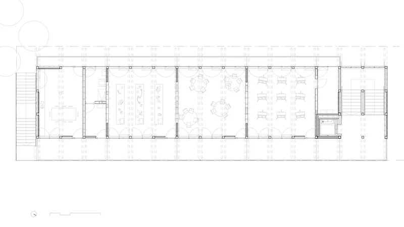 Floor plan drawing showing dining and gathering spaces with circular tables and regular structural columns
