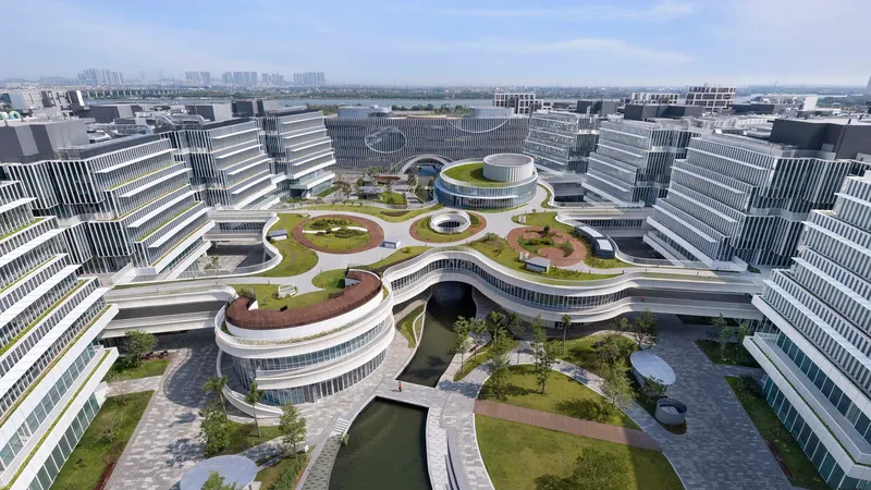 Aerial view of curved rooftop terraces with planted beds surrounding a central courtyard and water features