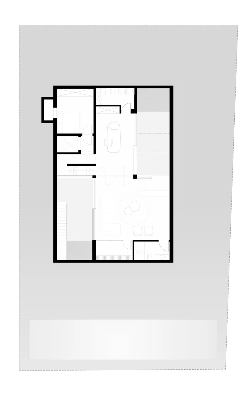 Floor plan showing a rectangular residence with multiple rooms and a bath fixture indicated