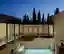 Valentino Architects Thread a Glazed Walkway Through Three 16th-Century Stone Houses in Malta