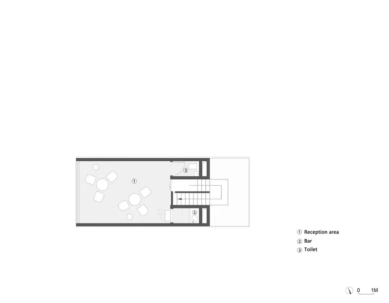 Floor plan drawing indicating a reception area with seating, a bar, and toilet facilities