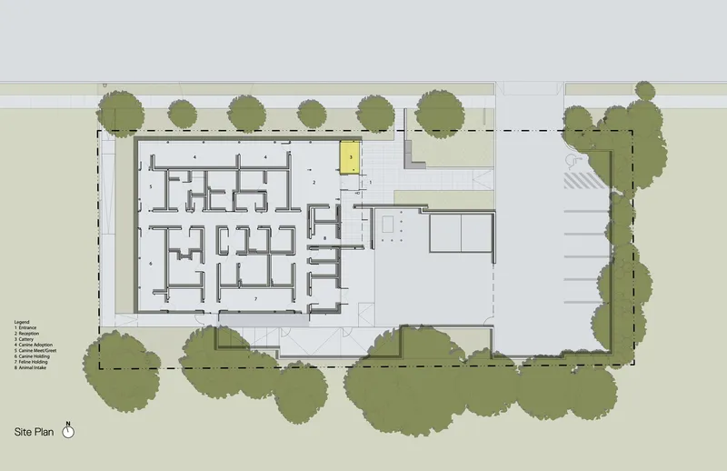 Site plan drawing showing a rectangular building footprint surrounded by trees on three sides