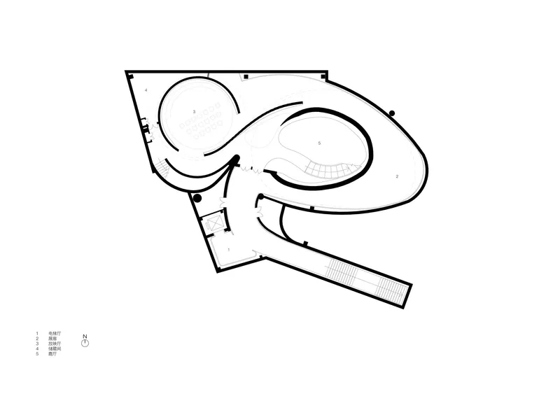 Floor plan drawing revealing organic curved volumes with tiered seating and a connecting linear corridor