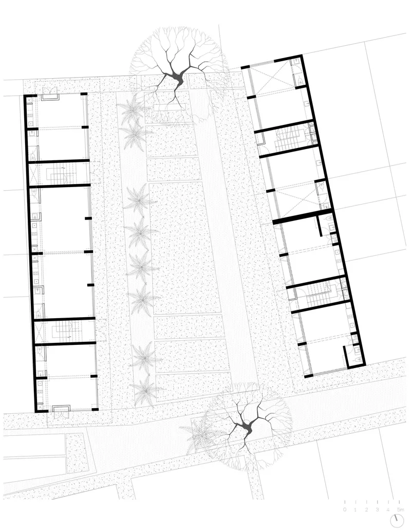 Floor plan drawing showing two residential wings flanking a central landscaped courtyard with palm trees