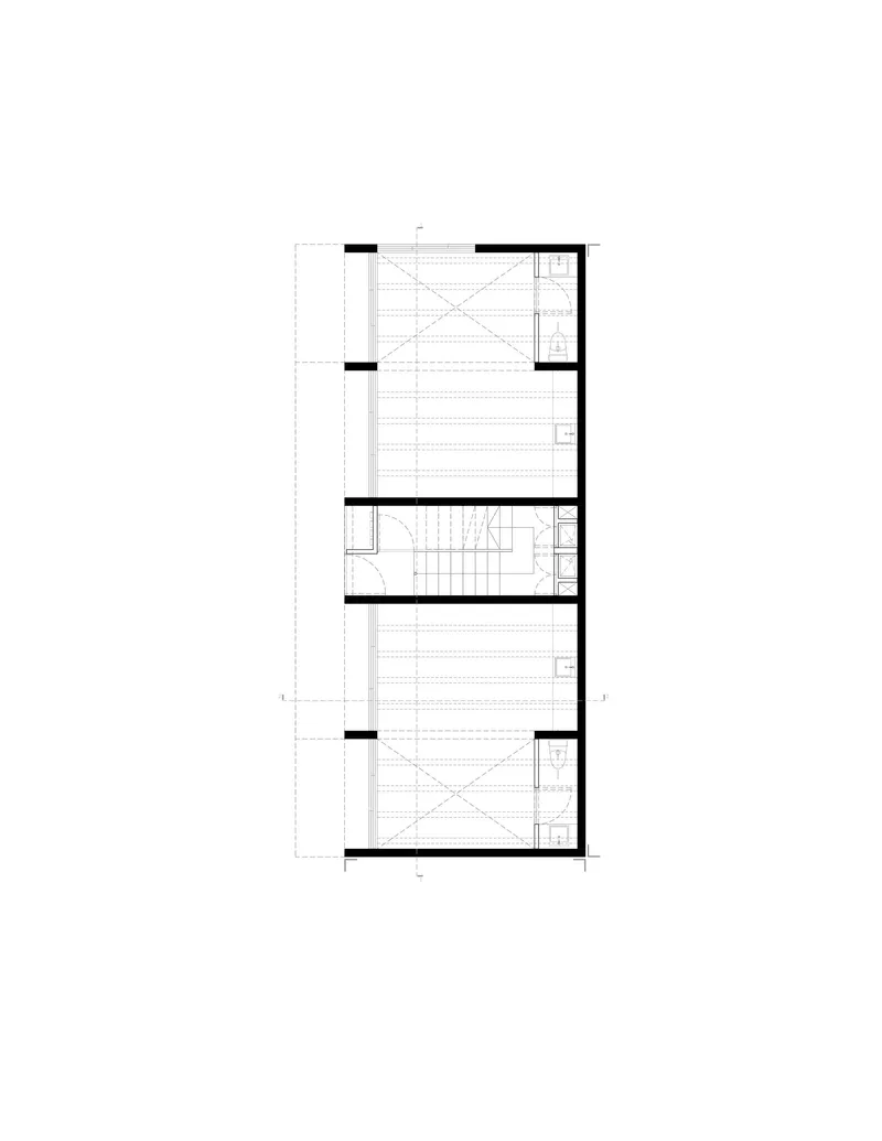 Floor plan drawing showing two residential units separated by a central stairwell