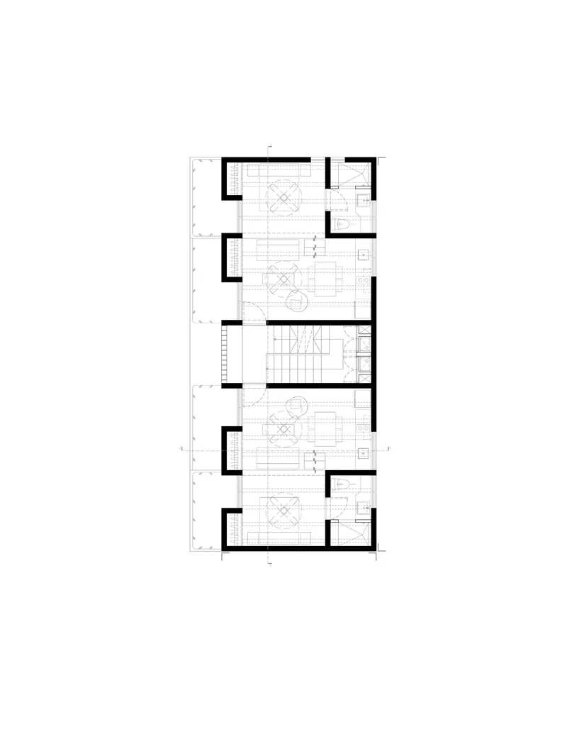 Floor plan drawing showing three dwelling units with kitchens and living spaces around a stair core