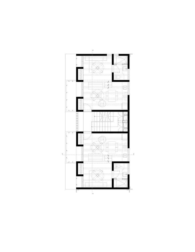 Floor plan drawing showing three stacked residential units with shared central stairwell and side bathrooms