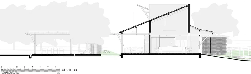 Section drawing showing pitched roof volumes with double-height interior spaces and landscape beyond