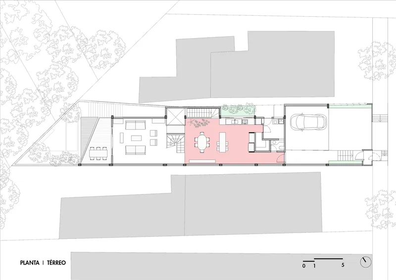 Ground floor plan drawing showing dining area, outdoor terrace, and carport with trees