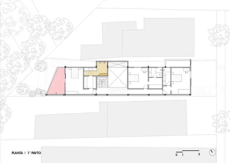 First floor plan drawing showing room layouts with a central staircase and color-coded zones