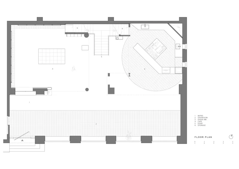 Floor plan drawing showing an exhibition area with circular counter and gridded outdoor terrace