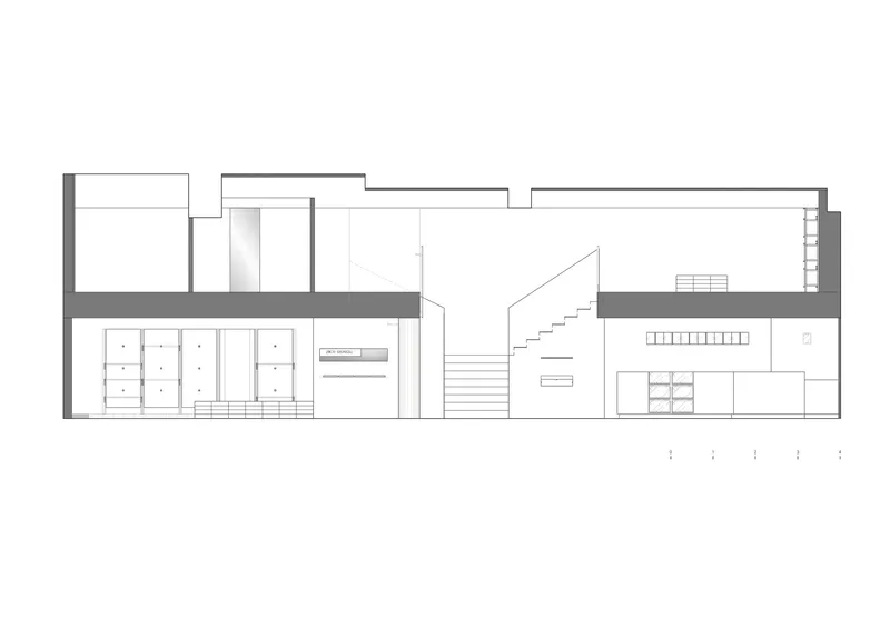 Section drawing revealing a double-height space with stairs connecting offset floor levels
