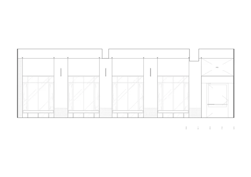 Elevation drawing showing a series of four identical storefronts with transom windows above