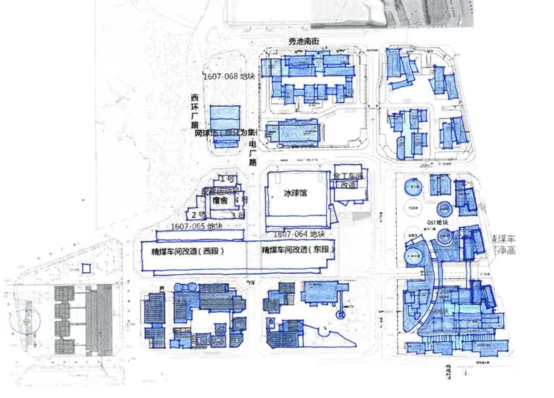 Site plan drawing with blue-filled building footprints scattered across multiple blocks with annotations