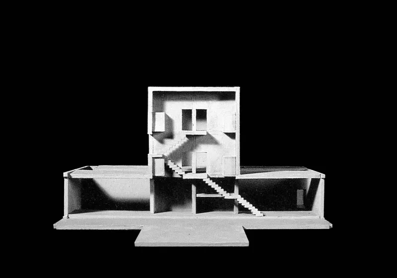 Section model showing the central double-height space with a staircase connecting two levels