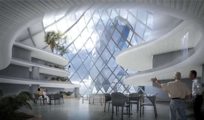 Light-filled interior spaces connect visitors with panoramic ocean views through the reflective geometric façade.