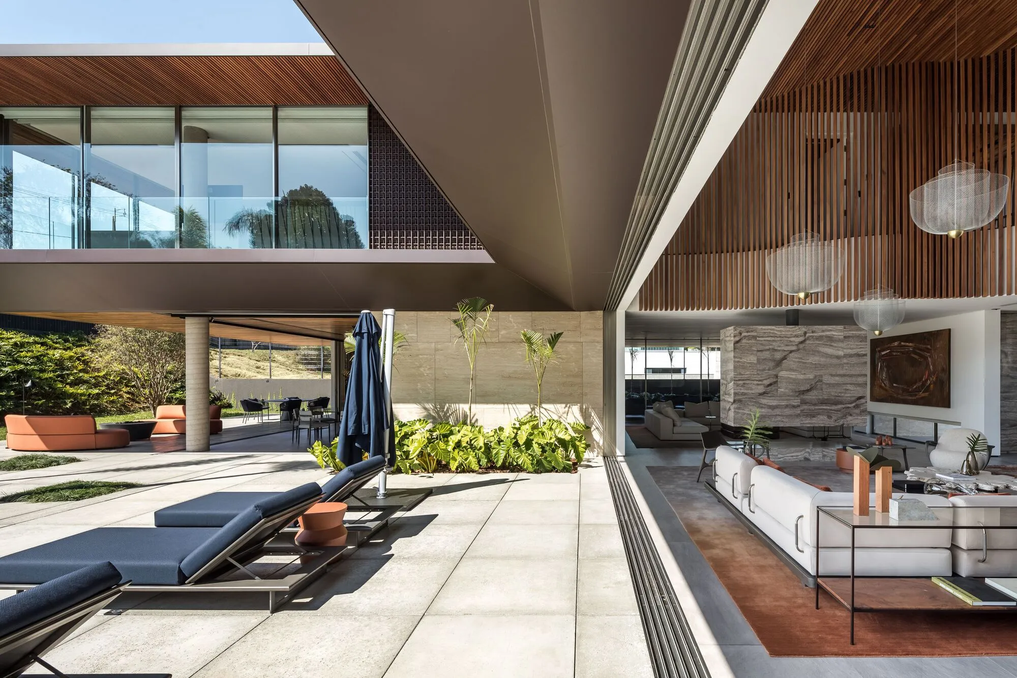 Schuchovski Arquitetura Cantilevers a Timber-Lined Villa Over Curitiba's Steep Terrain