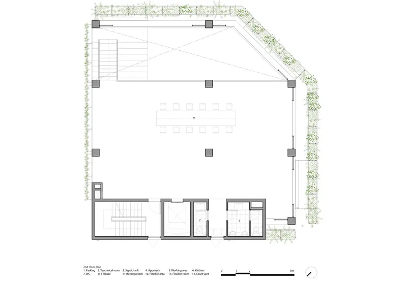 First floor plan drawing with open workspace and planted edge along two facades