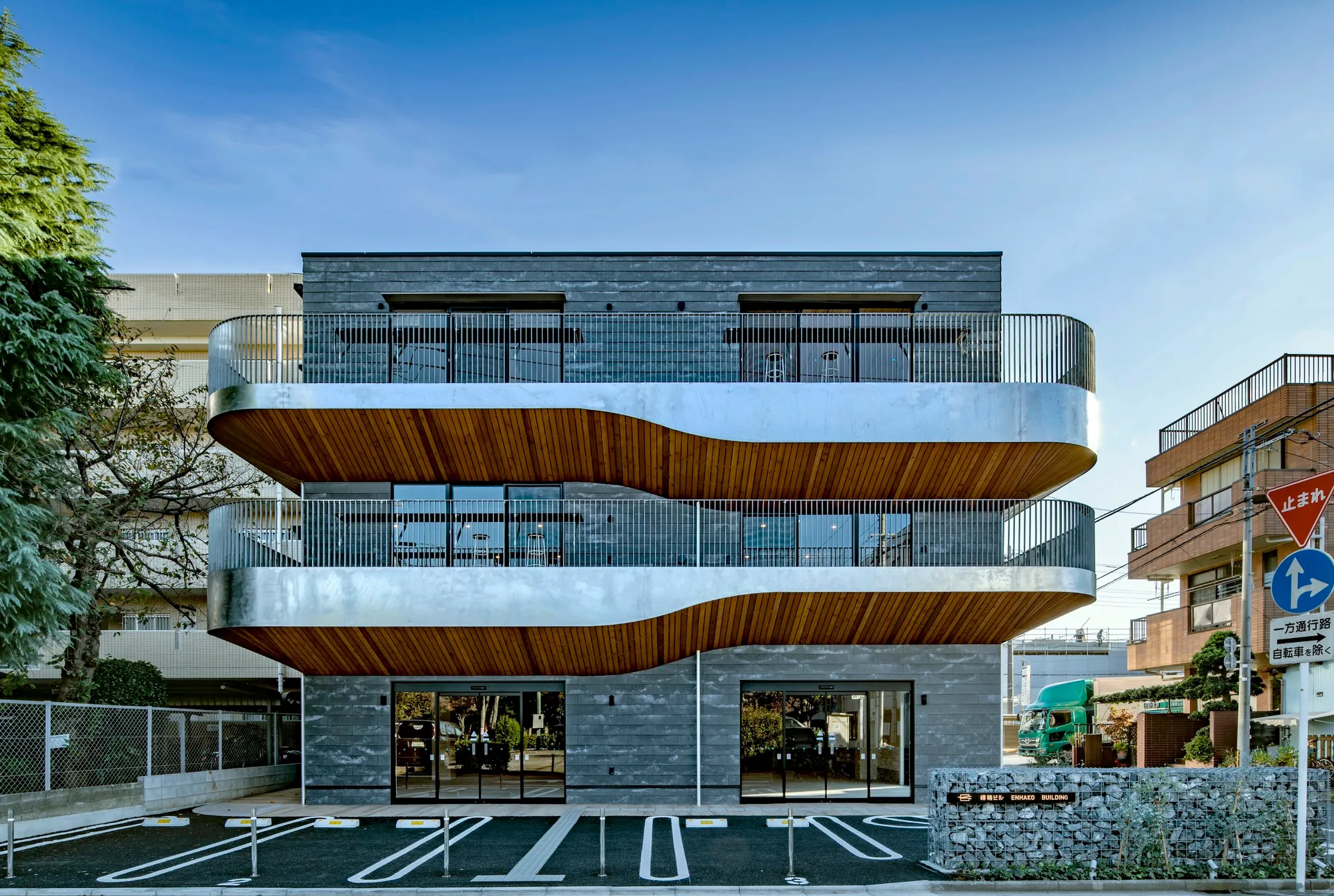 Organic Design Inc Shapes a Suburban Commercial Building as a Community Perch in Saitama