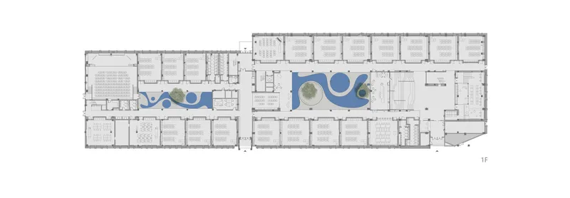 First floor plan drawing showing classrooms flanking two central courtyards with curving blue water features and trees