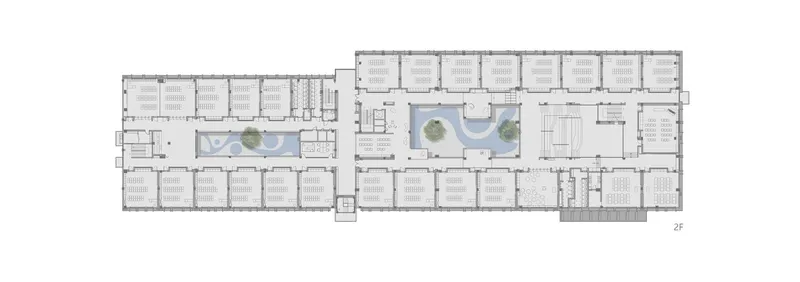 Floor plan drawing showing two parallel wings with interior courtyards and planted trees