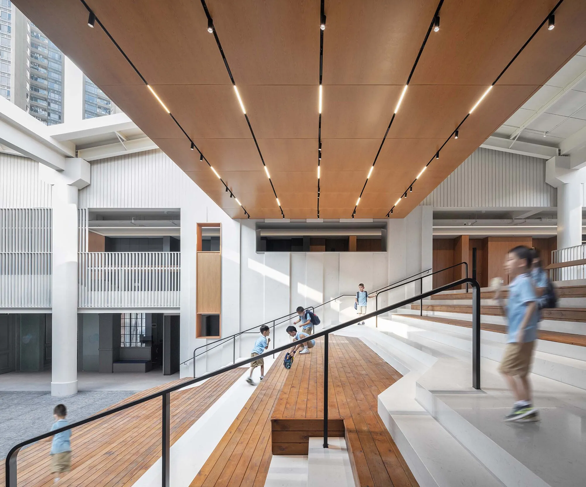 Atelier Global Converts Two Shenzhen Gymnasiums into a Mountain-Inspired Academy