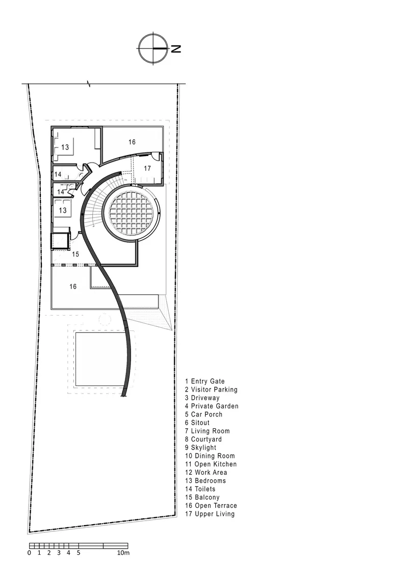 Upper floor plan drawing showing bedrooms clustered near a circular terrace with a curved driveway below