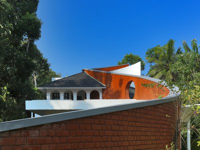 S Squared Architects Use a Freehand Curved Wall to Split Sacred and Domestic Life in Kerala
