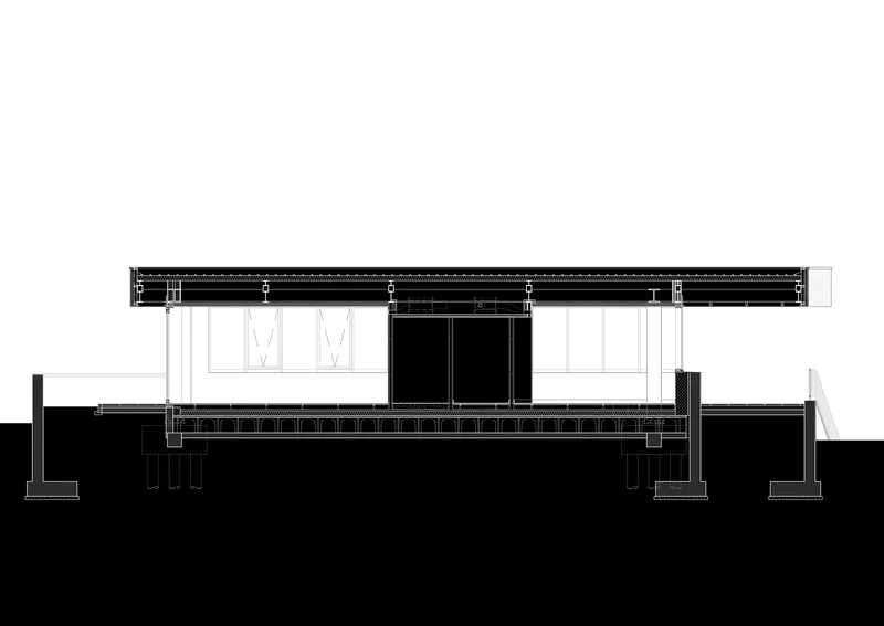 Section drawing illustrating the low-pitched roof structure with clerestory windows and raised platform base
