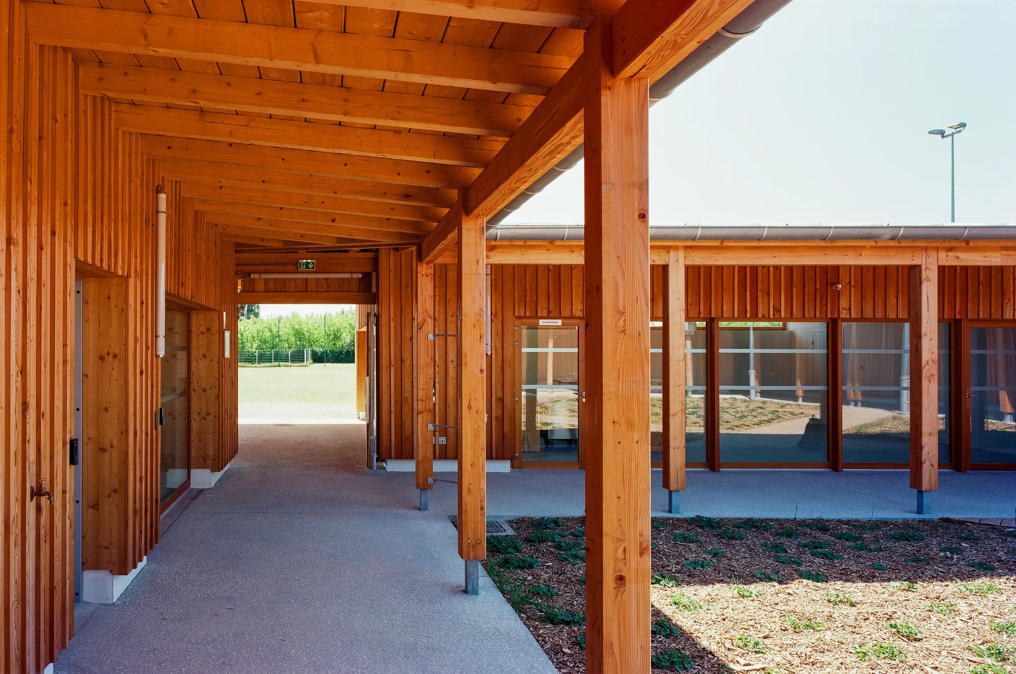 Bauchet de La Bouvrie Wraps Four Timber Volumes Around a Courtyard for a Football Clubhouse in La Riche
