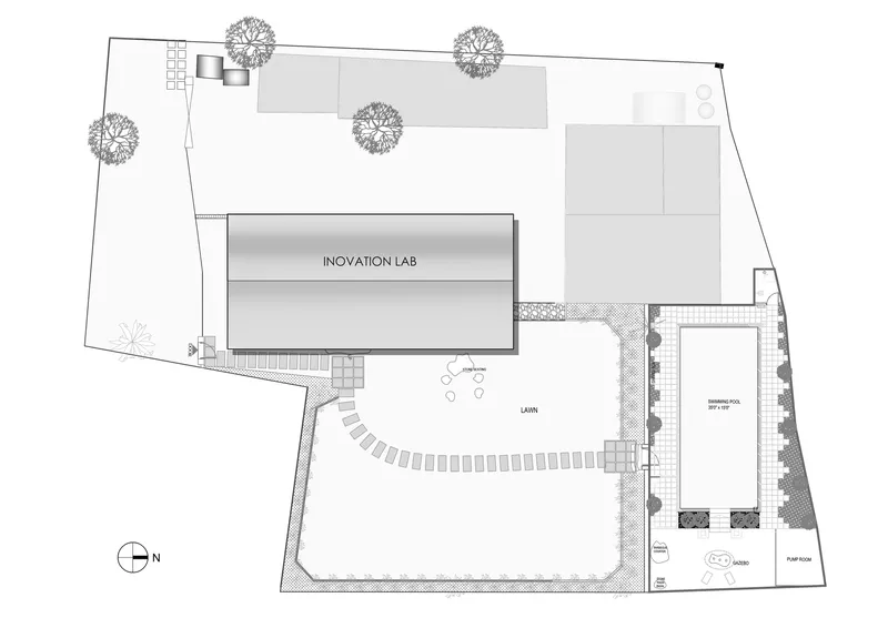 Site plan showing innovation lab building, lawn area, and swimming pool with surrounding landscape