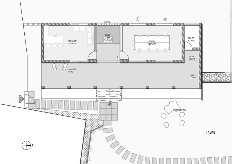 Floor plan drawing showing linear arrangement of cabin, studio, and toilet with fronting verandah