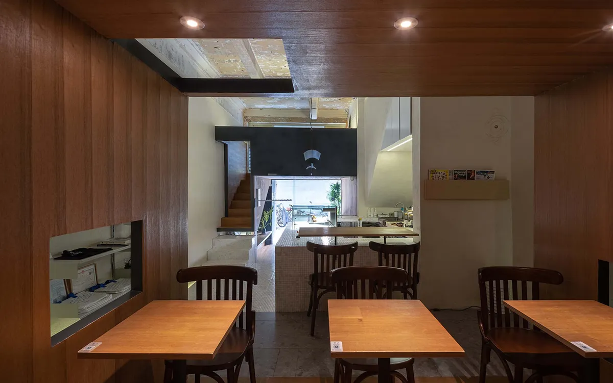 Atelier Waterside Threads a Timber Box Through a 1930s Guangzhou Tenement for Qualia Café